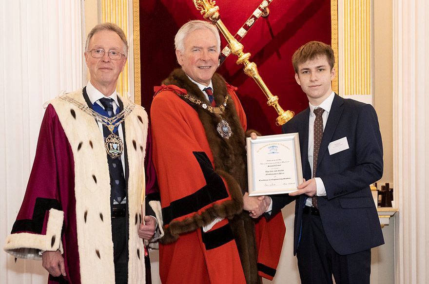 Pictured from right to left: Awarding-winning Sam Casey with Nicholas Lyons, the Lord Mayor of London, and Master John Mill of the Worshipful Company of Needlemakers. Picture credit: City and Guilds of London Institute Livery Company Prizes.