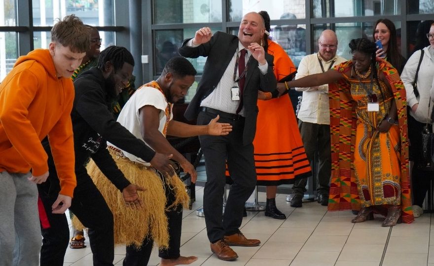 Students and our Principal, Darren Hankey taking part in Afrobeat Dancing at the Black History Month Opening Ceremony. Photo: HCFE
