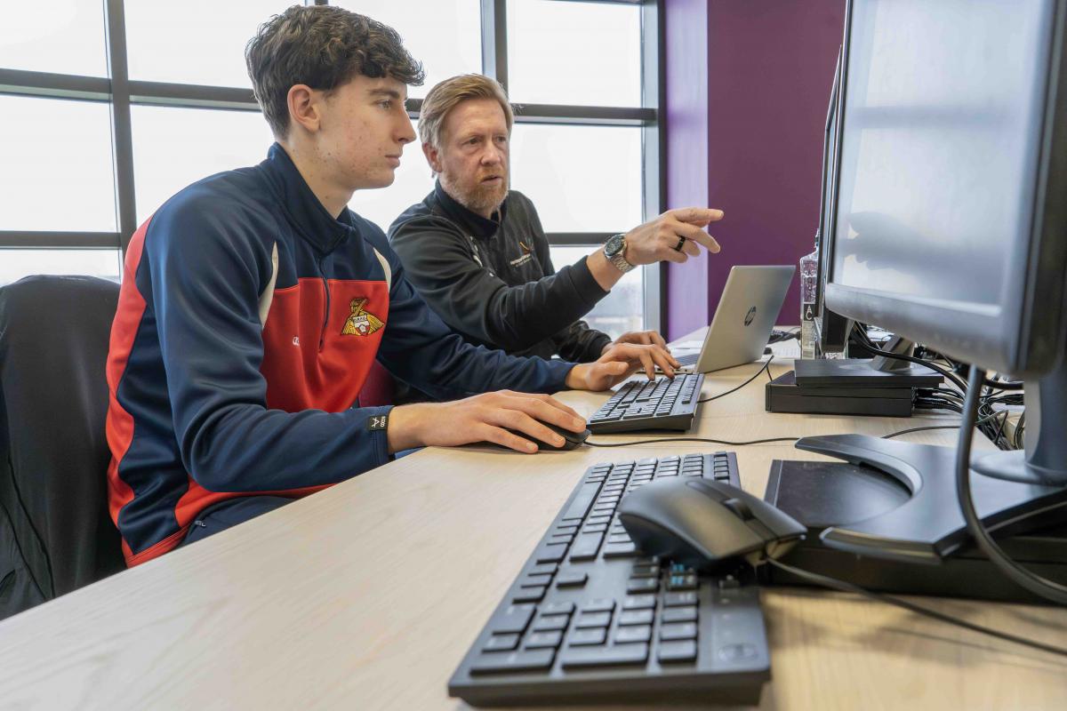 Lincoln Pawlak with Hartlepool College's former Doncaster winger Ian Clark