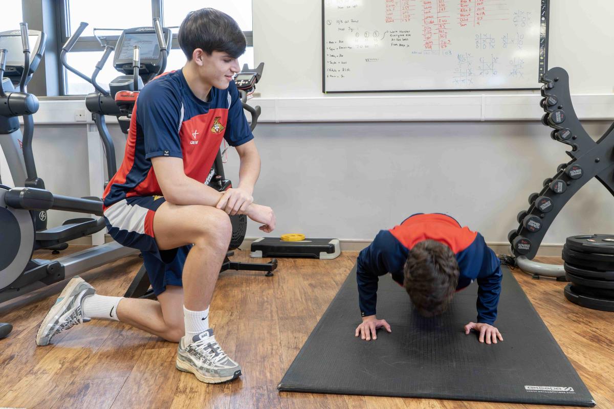 Alex Pavan, left, trains with Lincoln Pawlak, right