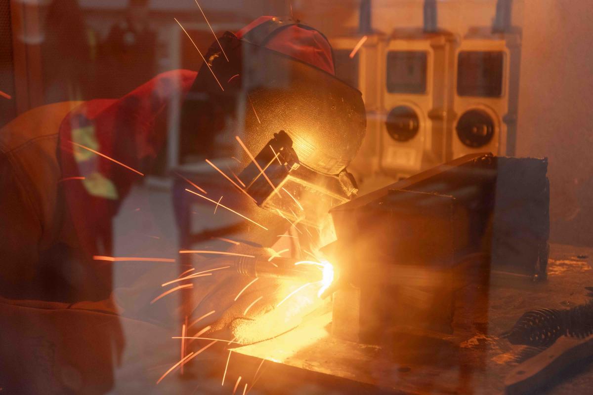 Fabrication and Welding student at work in a Centre of Excellence booth