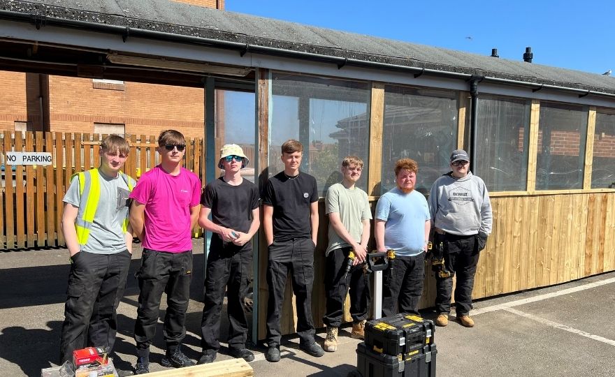 HCFE Constuction Students standing by the Restoration Work