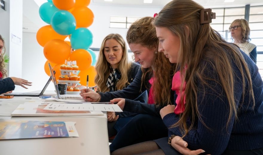 Travel and Tourism students working alongside Seaside Travel staff to gain hands-on experience in customer service, destination research and holiday planning.
