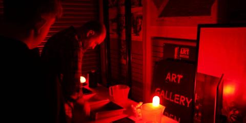Graham Vasey with HCFE Students in makeshift darkroom at Hartlepool Art Gallery