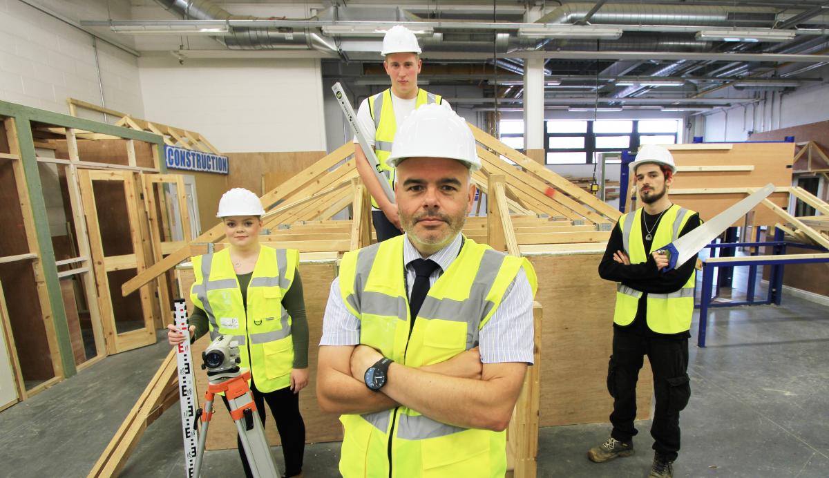 John Cartwright, Head of the School of Construction and Building Services at Hartlepool College, with students in the College’s dedicated, industry-standard facilities